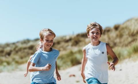 Children running on Spurn beach