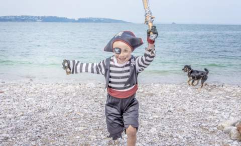 Pirate on Brixham Beach with dog