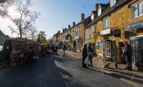 People shopping at the popular market in Moreton in Marsh in the Cotswolds