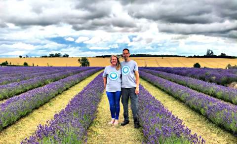 The two owners and tour guides from Cotswolds Guided Tours stand in a lavender field