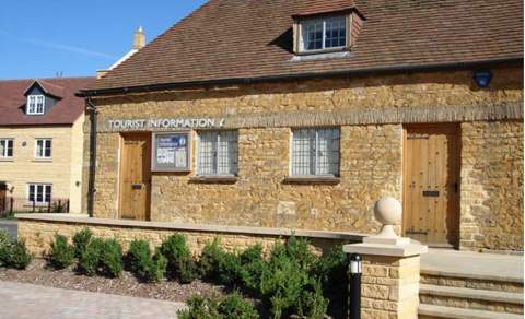 Honey-coloured stone steps lead up to the Tourist Information Centre in Broadway