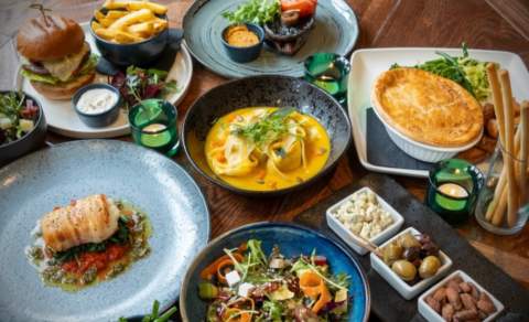 A table covered in delicious dishes at The Red Lion Long Compton in the Cotswolds