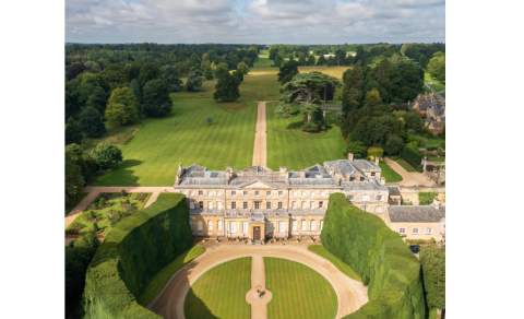 The mansion at Cirencester Park surrounded by its parkland