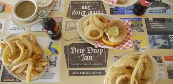 plates of food with cheeseburger and onion rings