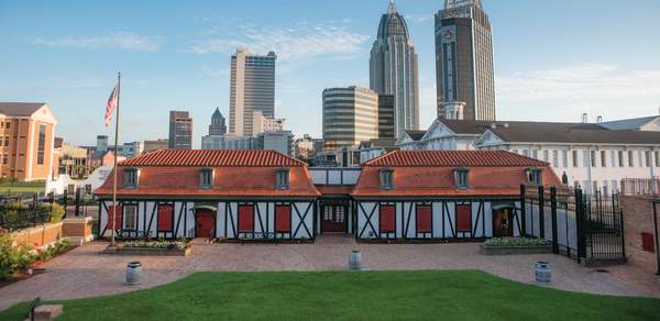 historic fort with high rise buildings in the background