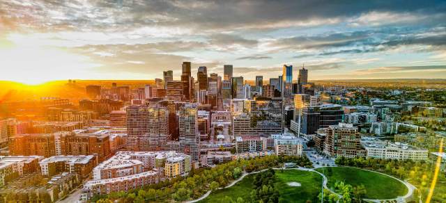 An aerial view of the Denver, Colorado, skyline during sunrise.