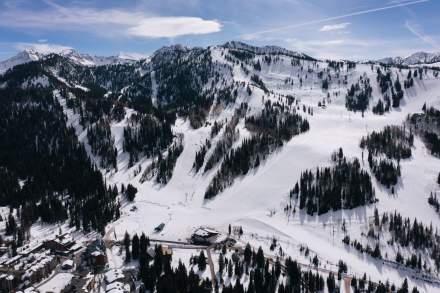 A view of Solitude mountain with snow, showing the trails