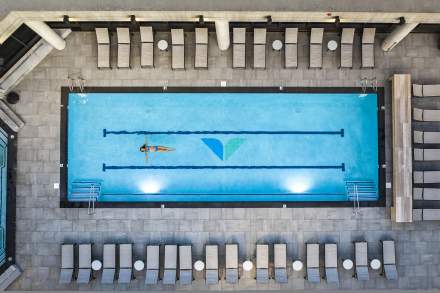 Woman relaxing in pool at Snowbird's Cliff Spa