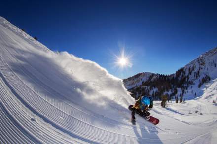 Snowboarder Powder Carving Groomer at Mineral Basin at Snowbird