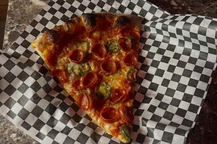 Pizza slice from Taverna Pizza in Salt Lake.