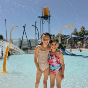 sisters posing in the new Island Park Pool.