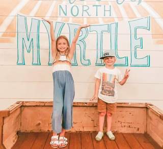kids in front of a mural