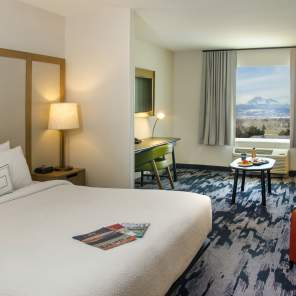Interior of a hotel room with a view of Long's Peak