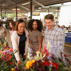 Group of people looking at items at the Ann Arbor Farmers Market