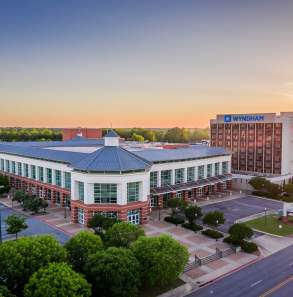 The sun sets behind the convention center in Fort Smith, Arkansas.