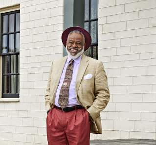 Austin tour ambassador Harrison Eppright standing outside the historic Susanna Dickinson House Museum