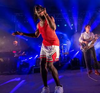 Black Pumas singer and guitarist on stage at Stubb's venue in Austin