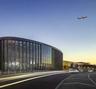 Austin airport east infill with plane flying overhead