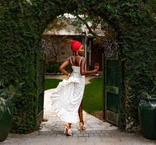 Laolu Onabanjo walks through gate at a winery in Driftwood Texas near Austin