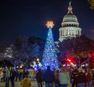 Texas Capitol building at night with Christmas Tree