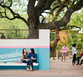 Couple sitting outside of the Fresas patio in Austin Texas