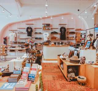 Modern clothing and merchandise displays at the Austin Visitor Center.