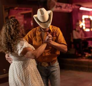 Man and woman two-stepping at White Horse