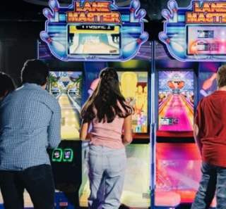 people playing arcade games