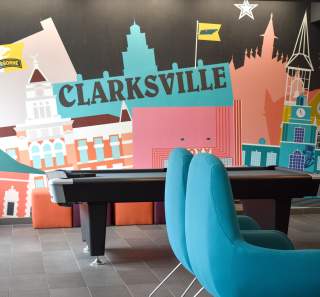 city skyline mural inside a hotel lobby