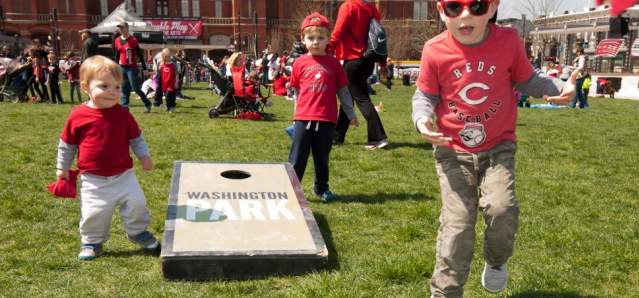 Kids playing cornhole during Reds Opening Day Celebration at Washington Park (photo: Lowry Photo)