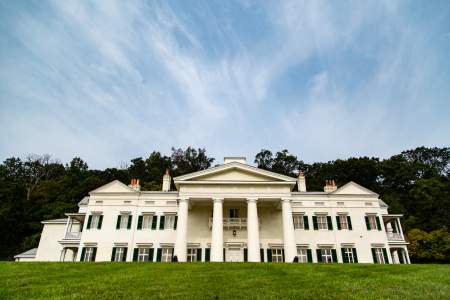Grand white neoclassical mansion in Morven Park rising above manicured lawns in Leesburg, Loudoun County, Virginia