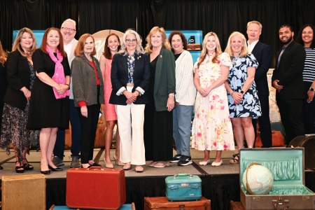 High Quality photograph of the Visit Loudoun Staff on a stage at the 2026 Annual Meeting