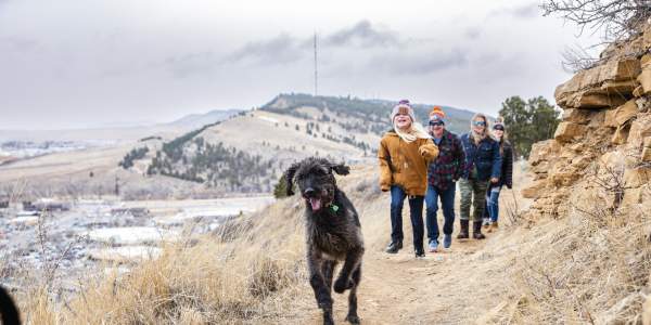 family hiking the trails of skyline wilderness area with dogs