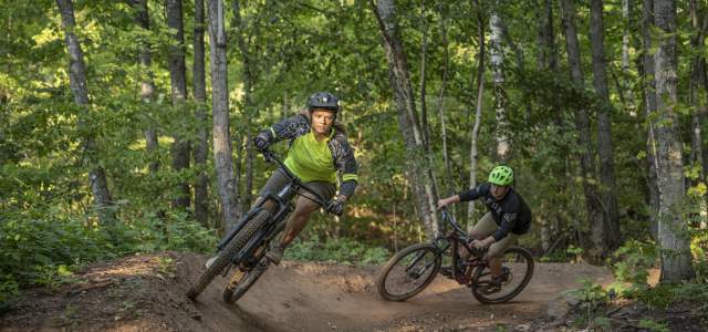 Two mountain bikers riding in Copper Harbor.
