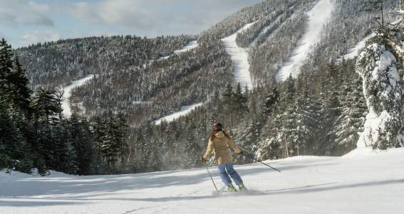 Woman skiing down Gore Mountain
