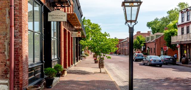 The road, sidewalks, and buildings are all made of brick in Historic Main Street in St. Charles, MO