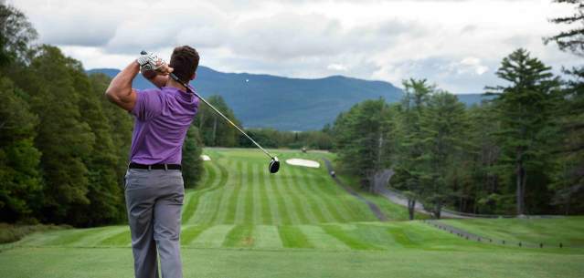 Man Teeing Off at the Golf Course