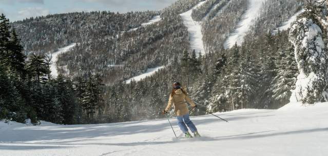 Woman skiing down Gore Mountain
