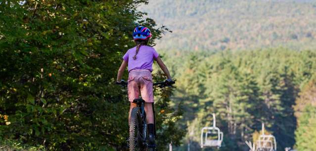 Kid mountain biking on Gore Mountain