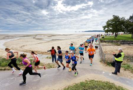 Runners in the Swansea Bay 10k running along Swansea Bay