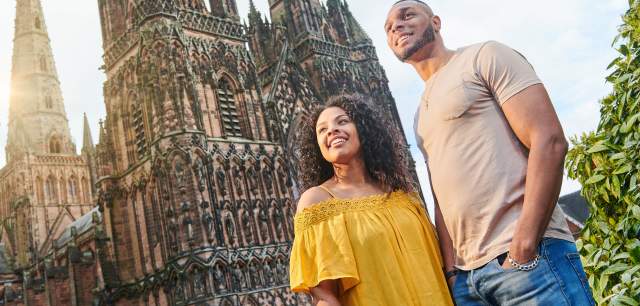 Couple outside Lichfield Cathedral on a sunny day