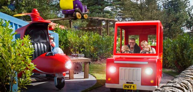 a family on the Postman Pat ride at CBeebies Land
