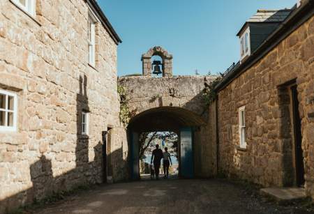 Couple walking through the Garrison Arch