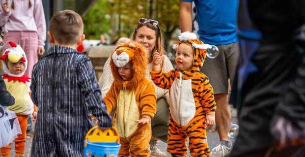 Children in costume gather for Halloween activities.