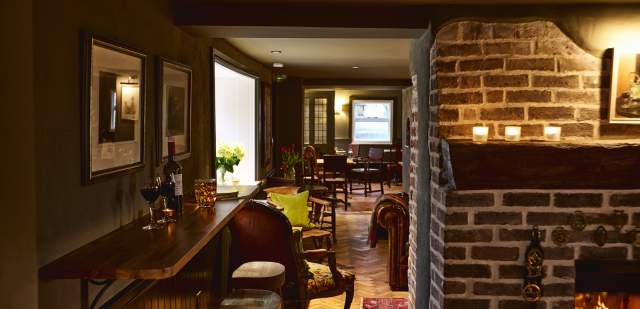 Interior bar chairs and fireplace at the Black Horse, Climping