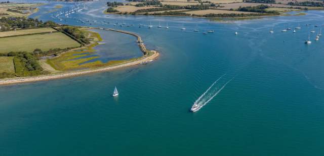Itchenor Channel  as viewed from the air, a wide water view with boats and landscape