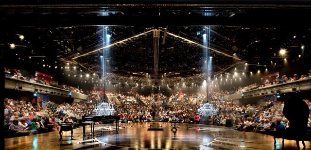 Interior view from the stage into the auditorium with packed seats at Chichester Festival Theatre