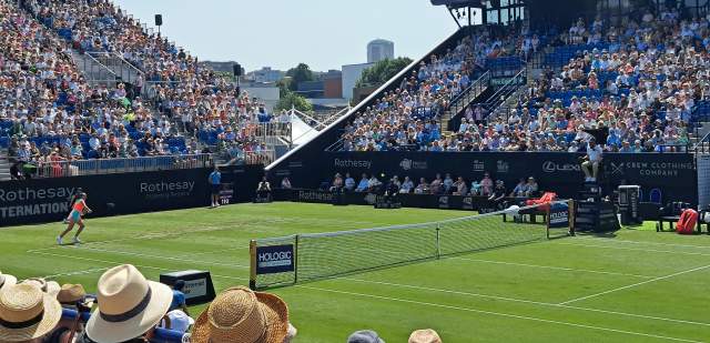 A tennis match played at Rothesay International tennis with busy crowds in the stands