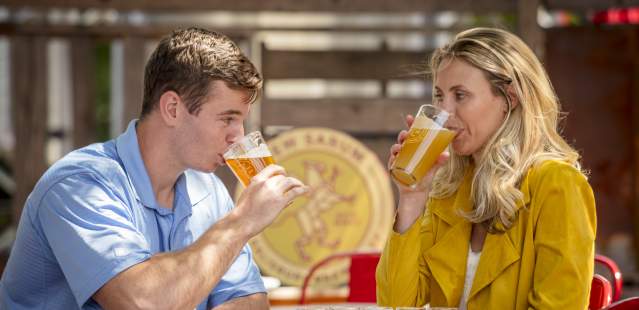 Couple enjoying beer at brewery