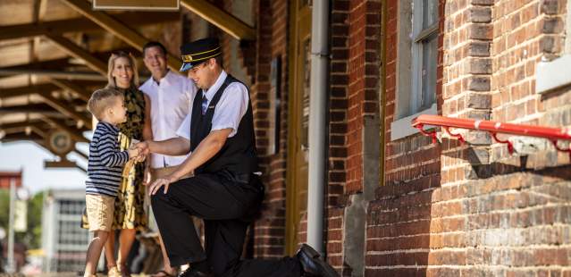 Family with conductor at the N.C. Transportation Museum